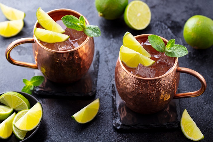 A refreshing, minty drink in a copy mule mug with plenty of ice and lime.