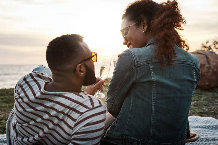 Couple at the beach looking at each other