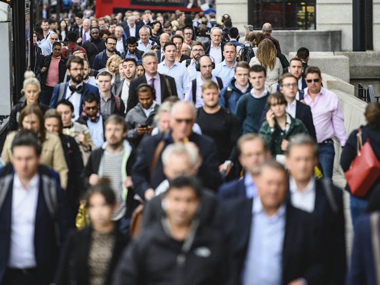 Large crowd of people commuting to work in London