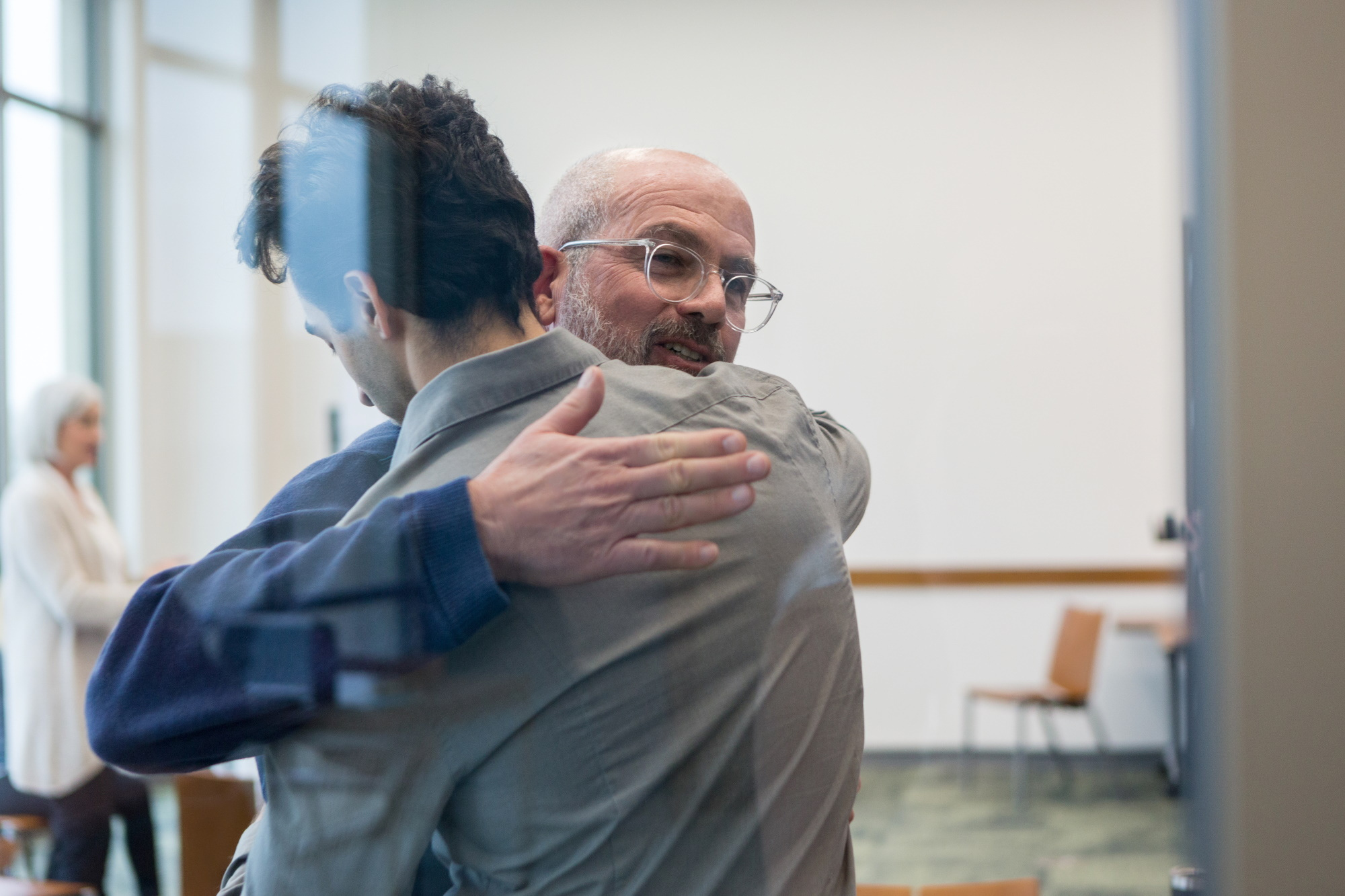 Father and son embrace