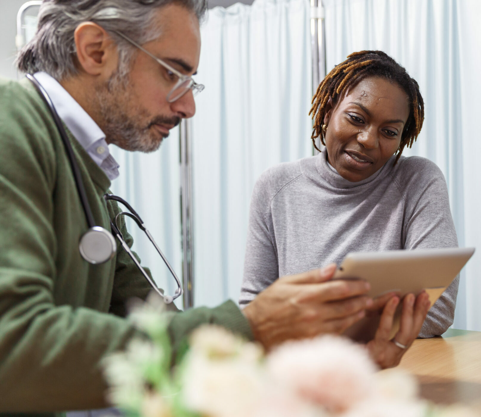 Female patient reviewing medical test results with her doctor