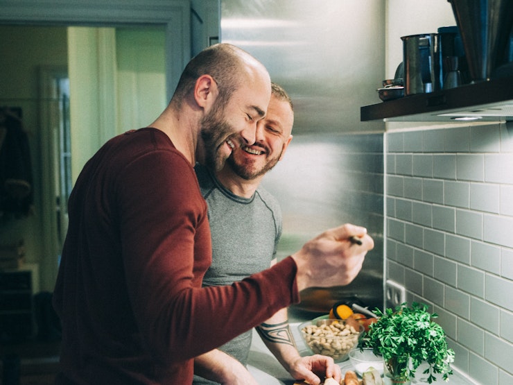 Gay couple preparing food