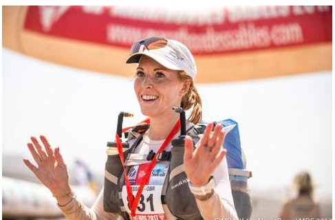 A woman in sports gear at a race.