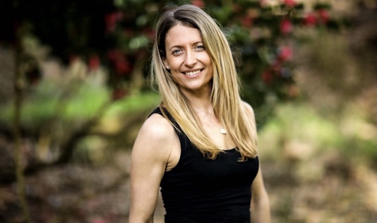 Kate outside at running event looking confident and happy