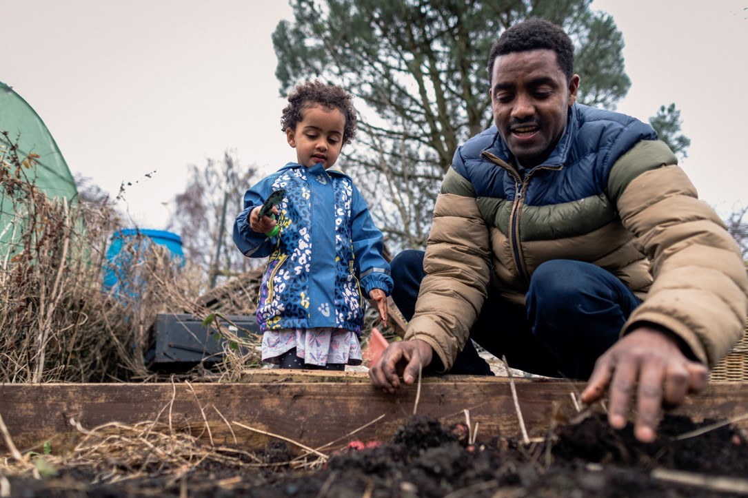 Man and child in garden