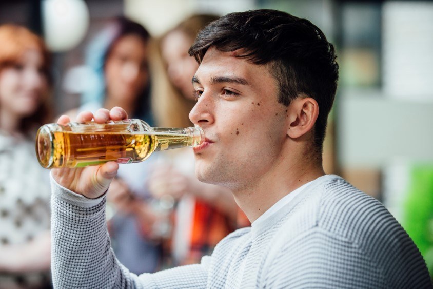 Man sipping beer