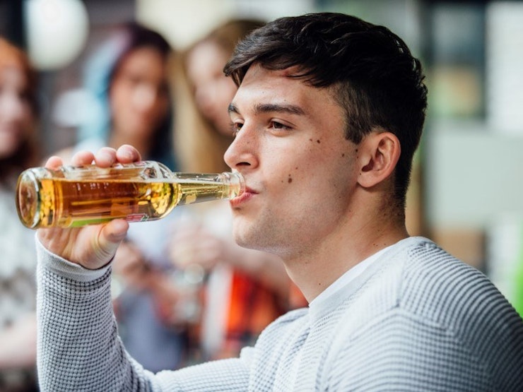 Man sipping beer