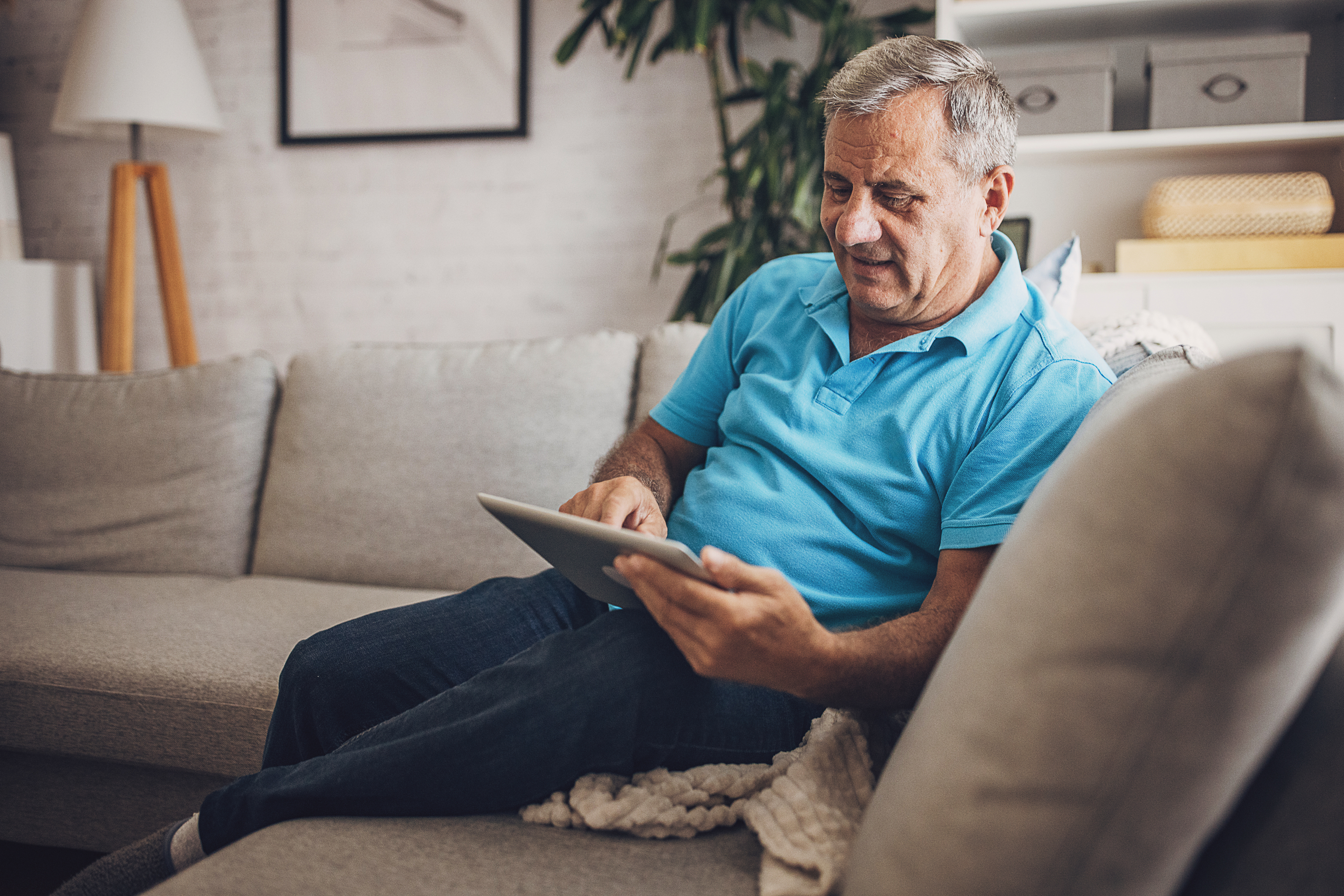 Older man using tablet