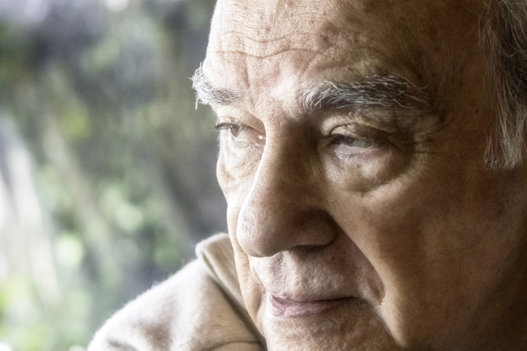 Pensive Hispanic Senior Man Looking Away Istock 954007508