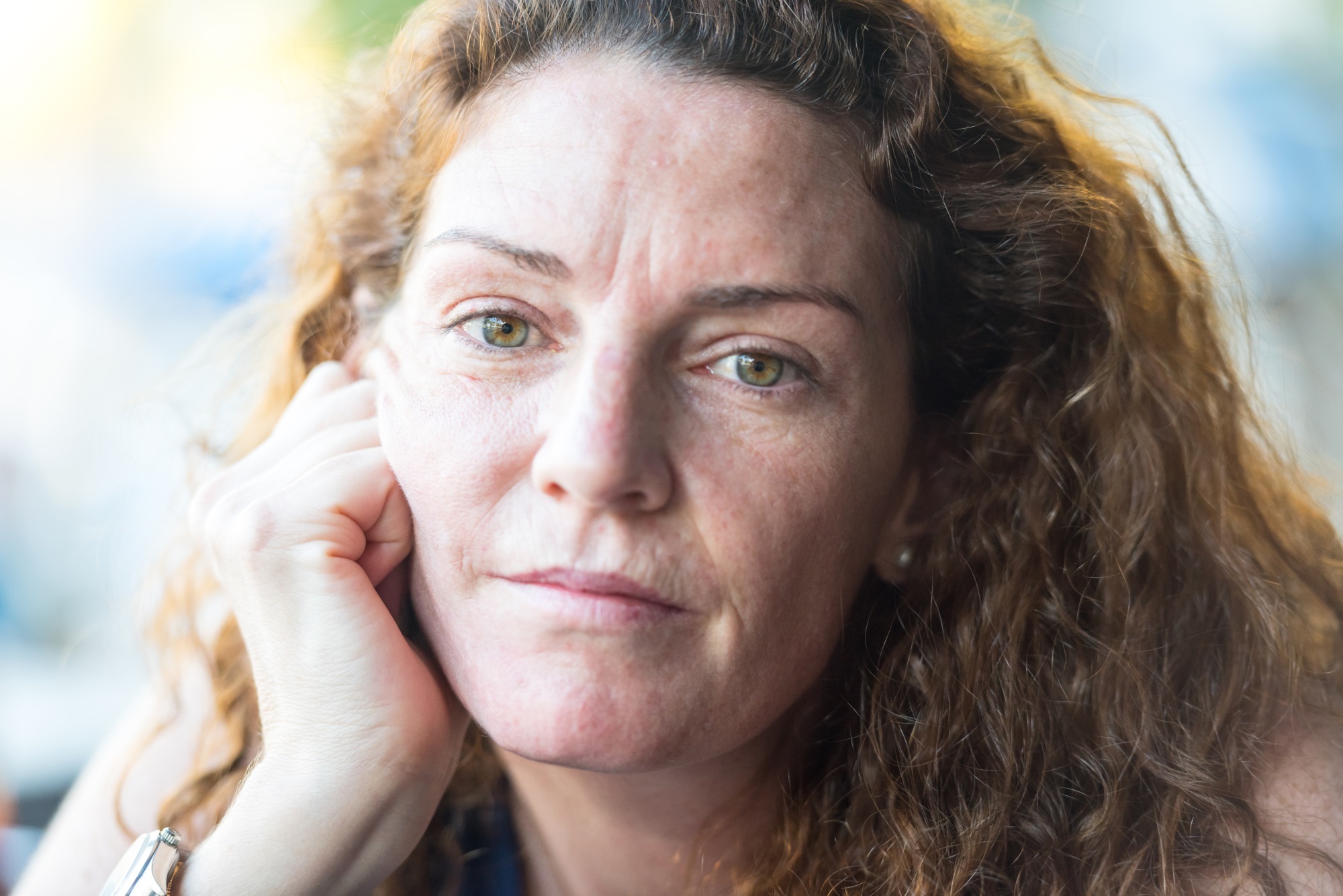 Pensive Mature Woman Looking Straight At Camera Istock 594017434