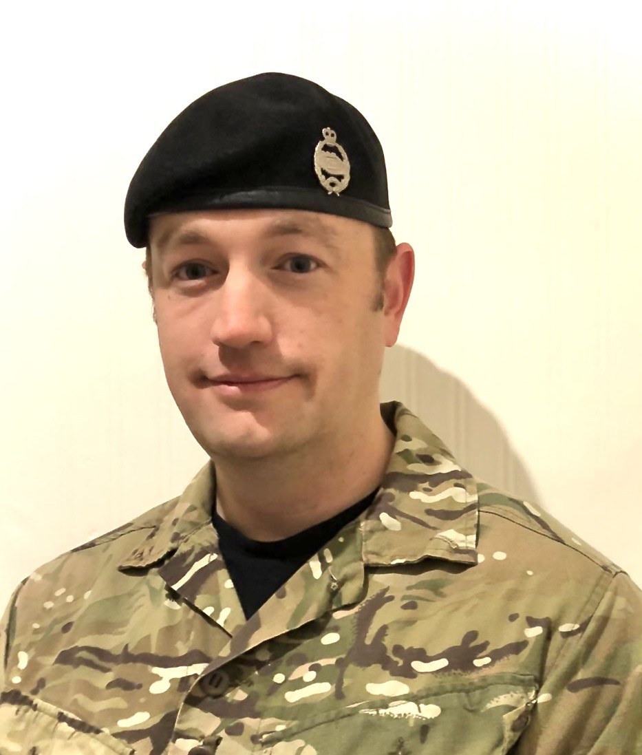 A soldier wearing a black beret.