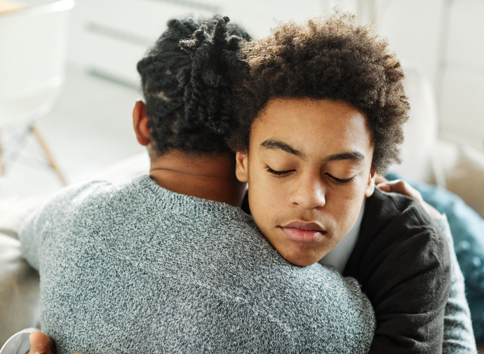 Two people hugging each other s