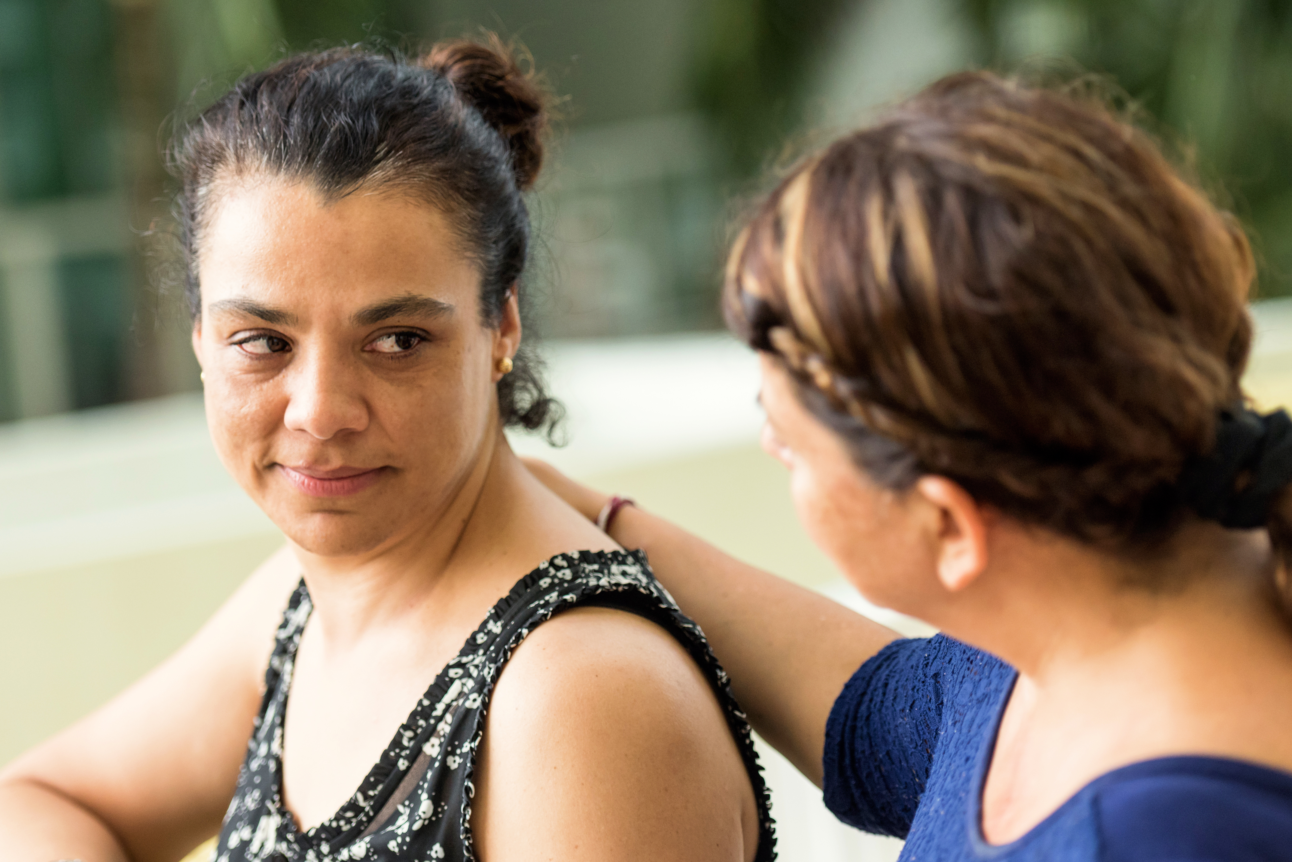 Woman being comforted by friend