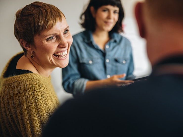 Woman smiling in meeting in office