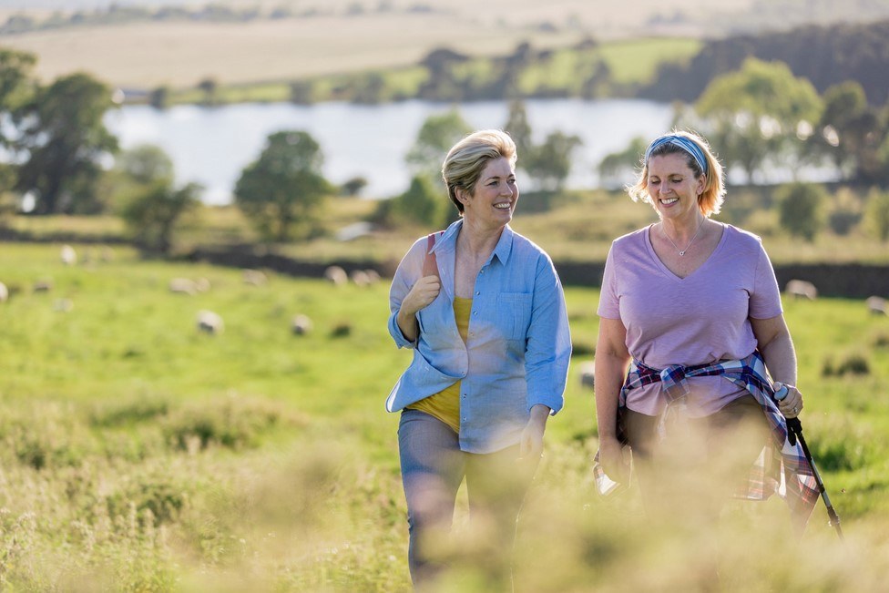 Women walking in countryside small