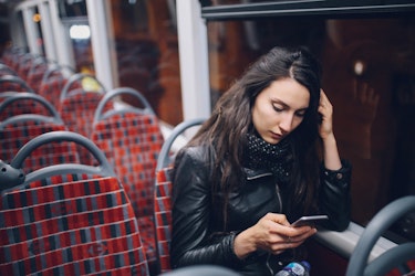 Young Woman Texting While Riding On The Bus In London At Night Istock 863278646