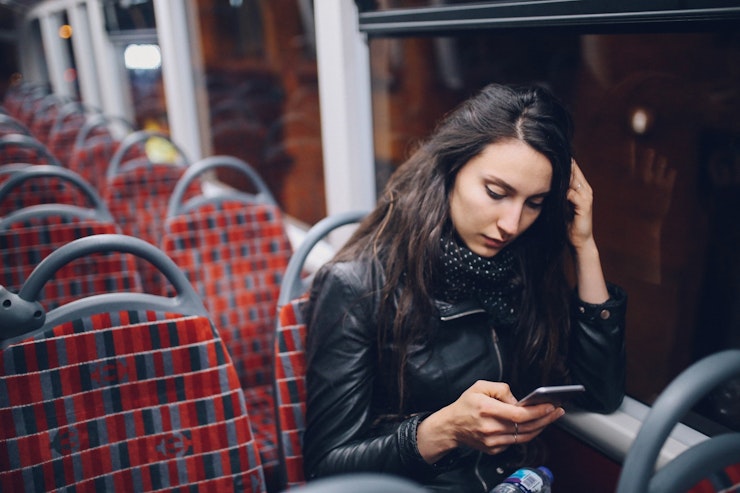 Young Woman Texting While Riding On The Bus In London At Night Istock 863278646