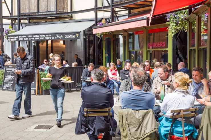 People eating outside restaurant